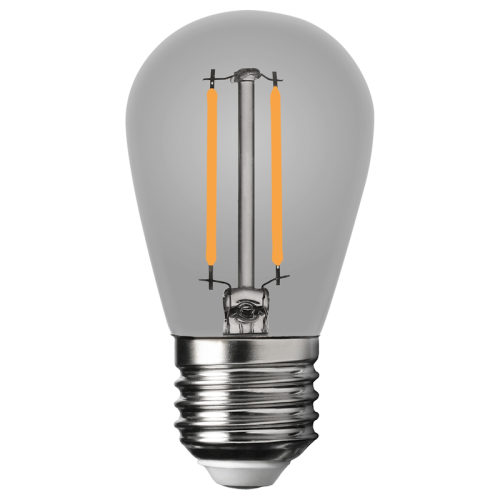 Żarówka LED filament E27 1W w dymionym szkle, z widocznymi pomarańczowymi włóknami wewnętrznymi. Kształt kulisty, z metalowym gwintem u dołu. Źródło światła emituje ciepłą białą barwę. W pozycji stojącej, na jednolitym tle.