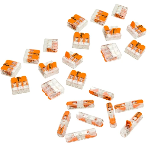 Zestaw 24 szybkozłączek do linki drutowej o średnicy 0,2-4 mm², w przezroczystej obudowie z pomarańczowymi elementami. Widoczne różne kształty złączek, w tym modele z dwiema i trzema przelotkami, rozłożone na białym tle.