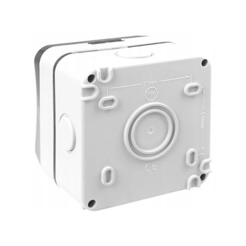 Gniazdo hermetyczne IP66 pojedyncze 16A 230V w kolorze szarym, o kwadratowym kształcie. Z przodu widoczny przycisk wyłącznika. Wymiary: 70mm x 55mm. Produkt w pozycji stojącej, z otworami montażowymi po bokach.
