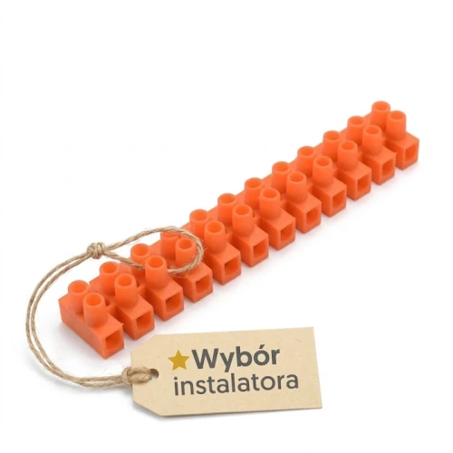 Listwa zaciskowa złączka 12-torowa PS-2,5mm2 w kolorze pomarańczowym, wykonana z tworzywa sztucznego. Produkt leży poziomo, z widocznym oznaczeniem Wybór instalatora na papierowej metce przymocowanej sznurkiem.