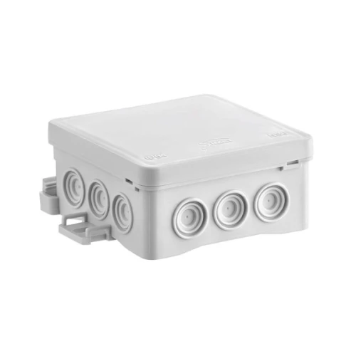 Puszka instalacyjna natynkowa NS6 w kolorze szarym, o wymiarach 85x85x40 mm. Kwadratowy kształt z pięcioma otworami na przewody, umieszczona w pozycji stojącej. Wykończenie gładkie, tworzywo sztuczne.