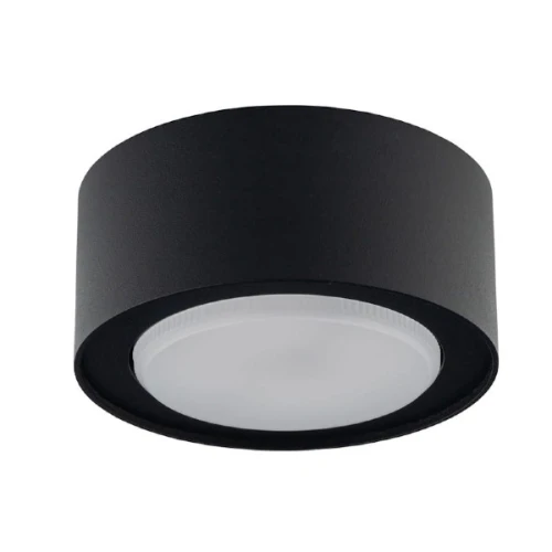 Żarówka LED GX53 230V 6W w neutralnej białej barwie, zamontowana w okrągłej, czarnej obudowie. Zdjęcie aranżacyjne. Widok frontalny, pokazujący gładką, matową powierzchnię klosza oraz wyraźny kształt i kolor oprawy.