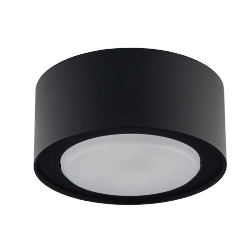 Żarówka LED GX53 230V 10W w neutralnej białej barwie, zamontowana w okrągłej, czarnej obudowie. Zdjęcie aranżacyjne. Widok frontalny, pokazujący gładką, matową powierzchnię klosza oraz wyraźny kształt i kolor oprawy.