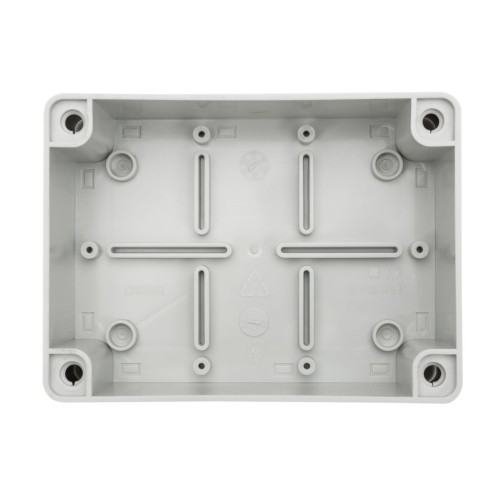 Puszka natynkowa szara o wymiarach 120x80x50 mm, bez dławików, z certyfikatem IP65. Widok z góry, ukazujący wewnętrzną strukturę z otworami montażowymi i wyżłobieniami dla kabli.