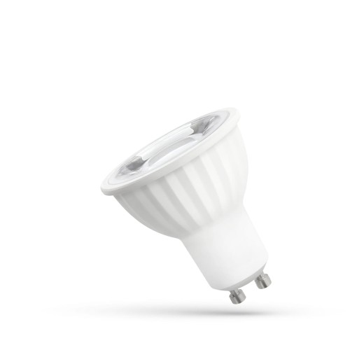 Żarówka LED GU10 6W o kącie świecenia 45°, w kolorze zimnego białego, z soczewką. Utrzymana w białej obudowie z rowkowaną fakturą, z metalowymi pinami na dole. Stoi w pozycji lekko pochylonej.