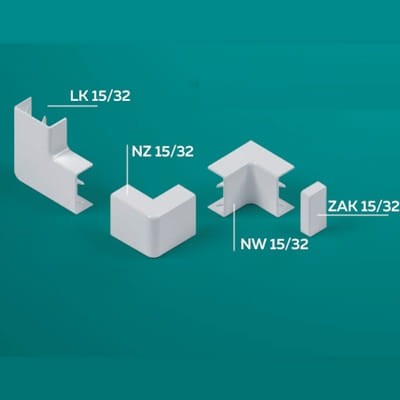 Biały łącznik kątowy LK 15/32, obok inne elementy: NZ 15/32, NW 15/32 oraz ZAK 15/32. Produkty mają prostokątny kształt i gładką powierzchnię, ułożone na jednolitym tle.